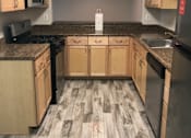 Thumbnail 9 of 25 - Modern Kitchen With Custom Cabinet at The Apartments at Wellington Trace, Frederick, Maryland