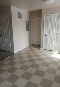 an empty room with a checkered floor