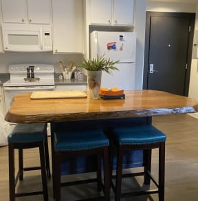 Kitchen with a wooden island at The Lofts at Union Alley