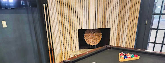 a billiards table in a game room with a poolat The Lodge Apartments, Tulsa, 74129