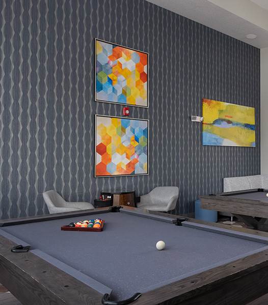 A pool table with a white ball on it.