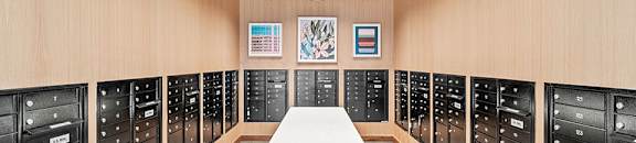 the locker room is equipped with new lockers and a table