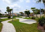 Thumbnail 23 of 26 - Walking paths and shaded areas at Coral Club, Bradenton, Florida
