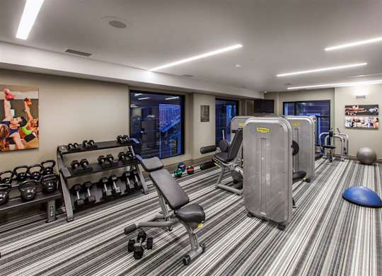 The Verdant Apartments fitness center with free weights in San Jose CA