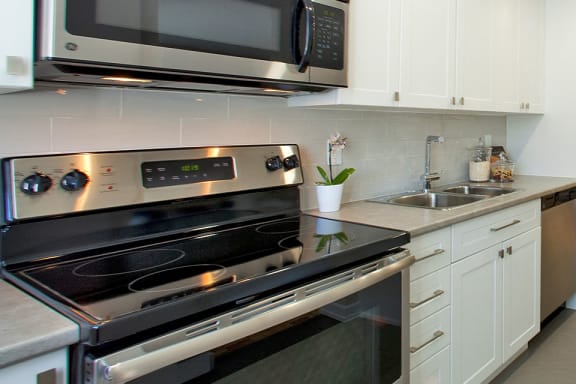 a kitchen with a stove and a microwave