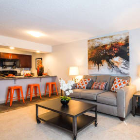 a living room with a couch and a table at Skyview Apartments, Westminster, CO