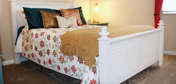 a bedroom with a bed with pillows on it  at East Pointe Apartments, Ohio, 45245