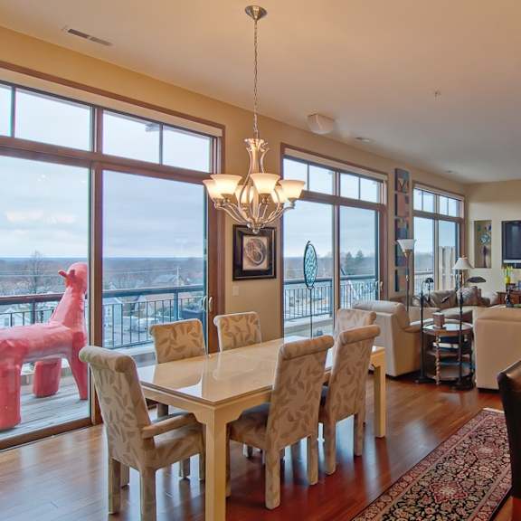 A dining room with a table and chairs. at Cornerstone & Ravenna* Apartments, Shorewood, Wisconsin