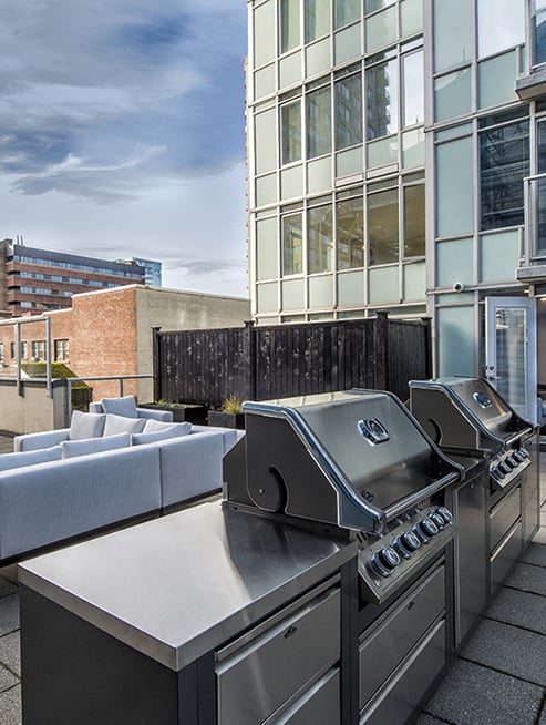 Wesley Place in Vancouver, BC Outdoor patio with shared BBQ grill