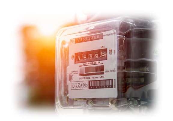 a thermometer in a plastic container with a sunset in the background
