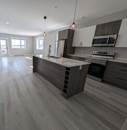 a kitchen with a large island in the middle