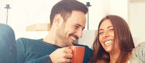 Couple with coffee for The Chapman Apartments