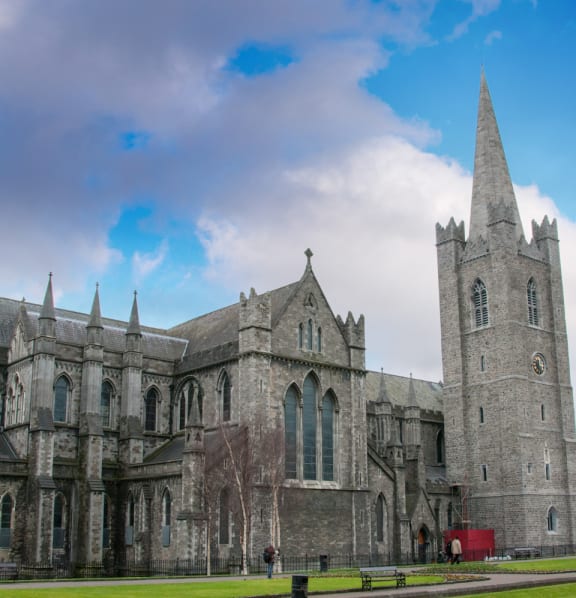 a large stone church with a tall tower and a steeple