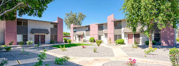 a street view of an apartment complex with trees and landscaping at Connect on Missour Apartments, Phoenix 85015