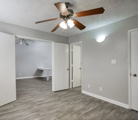 a bedroom with a ceiling fan and a closet at Valencia Park, Phoenix, Arizona