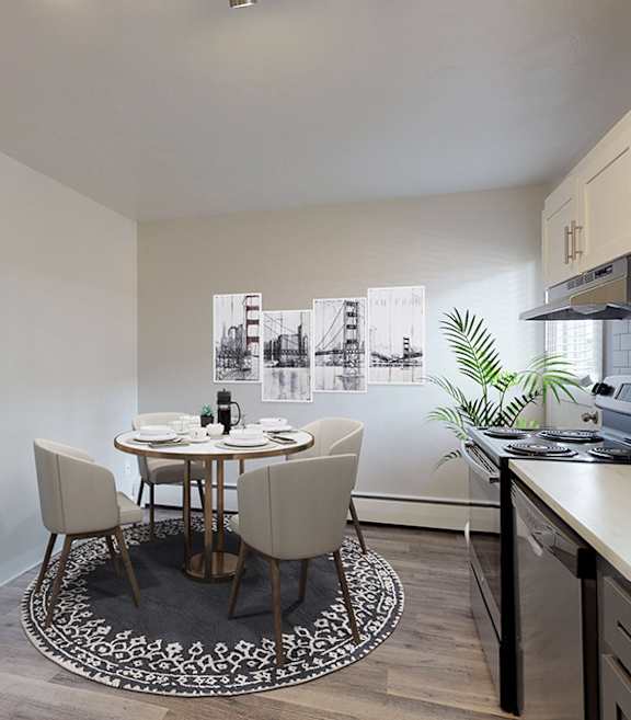 A kitchen with a table and chairs in the middle of the room.