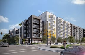 A modern apartment building with a mix of black and white and yellow accents.