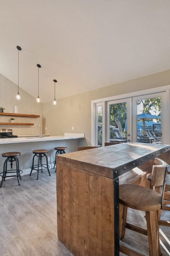 a kitchen with a large island and bar stools