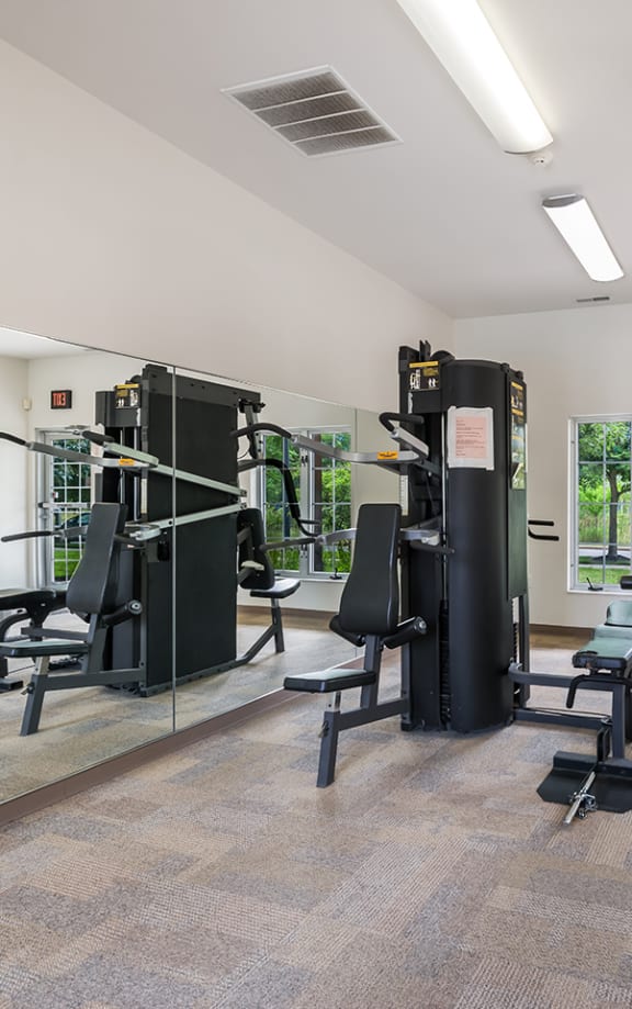 A fitness center with cardio equipment at Duneland Village Apartments and Townhomes in Gary, IN