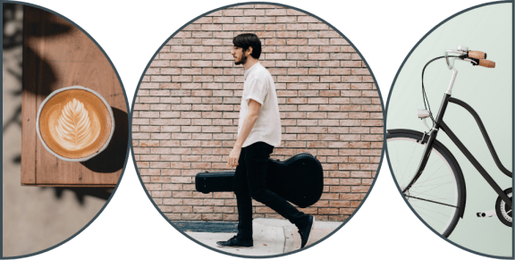 a man carrying a guitar case and a bicycle