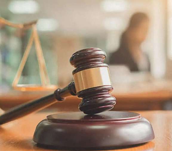 a judge s gavel on a desk in a courtroom
