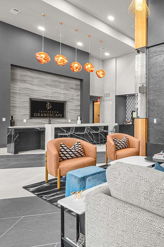 A modern lounge area with a fireplace and comfortable seating.