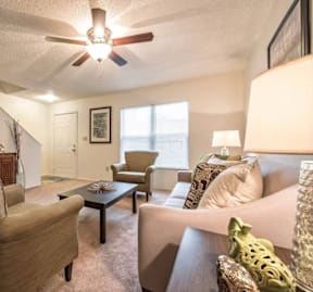 A living room with a brown chair and a brown table.