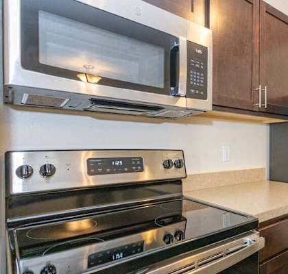 a kitchen with a stove microwave and refrigerator