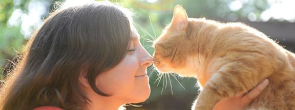 Woman Holding Cat at The Core in Houston, TX 77007