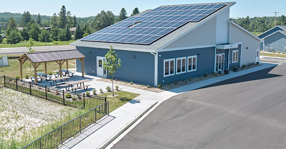 A modern building with solar panels on the roof.