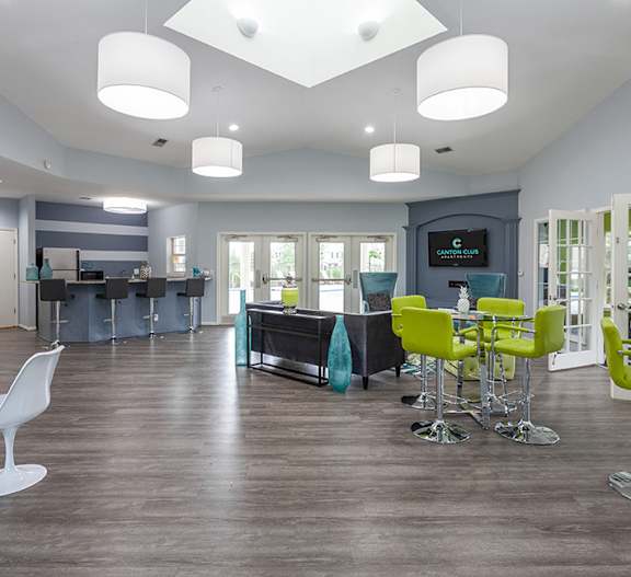 A modern open plan living and kitchen area with a bar.