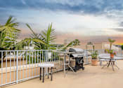 Thumbnail 6 of 8 - the patio has a bbq grill and a table and chairs