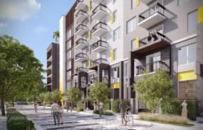 A modern apartment complex with balconies and a pedestrian walkway in front.
