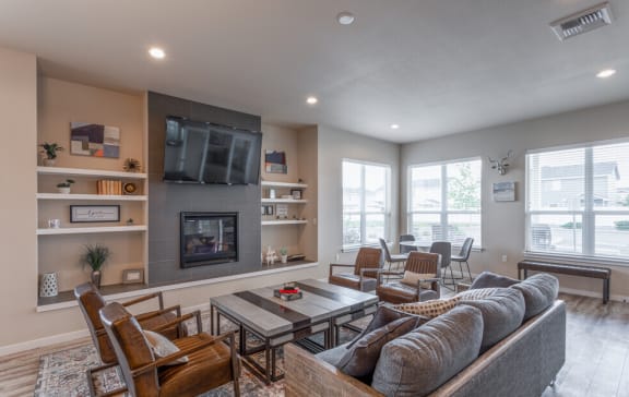 a living room with a couch and a table and a television