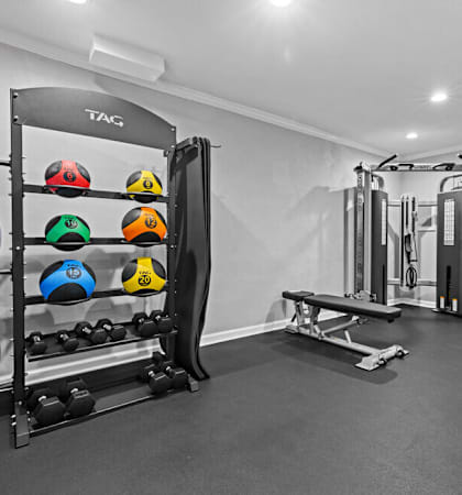 a home gym with weights and equipment