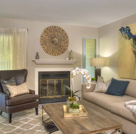 a living room with a couch and a chair and a fireplace at KIRKER CREEK, Pittsburg, CA, 94565