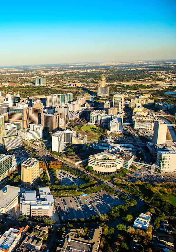 A bird's eye view of a residential area with houses and roads.