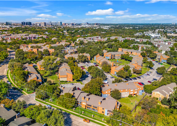 A bird's eye view of a residential area with houses and apartment buildings.