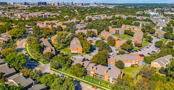 A bird's eye view of a residential area with houses and apartment buildings.