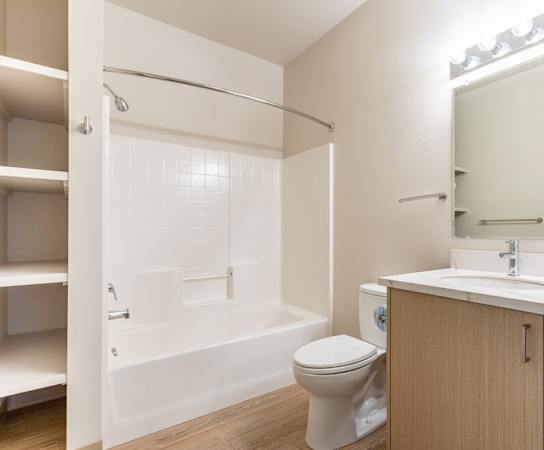 White bathroom with toilet at Wilsonville Summit Apartments, Oregon