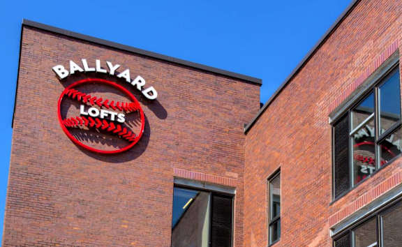 Community exterior with signage at Ballyard Lofts, Iowa
