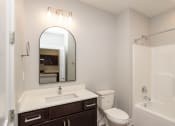 Thumbnail 38 of 48 - a bathroom with a sink toilet and a shower