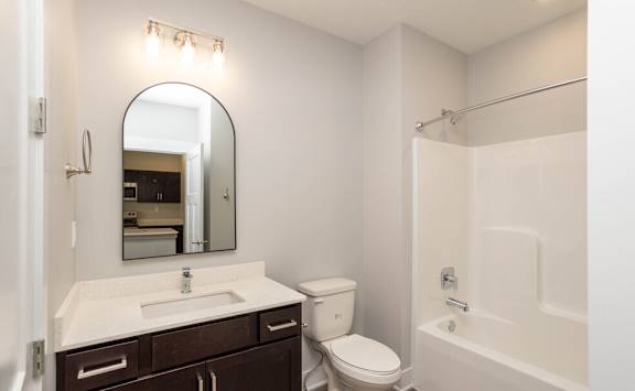 a bathroom with a sink toilet and a shower