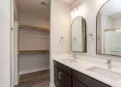 Thumbnail 33 of 48 - a bathroom with two sinks and a large mirror
