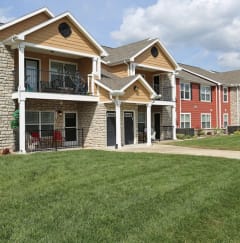 a row of houses with grass in front of them