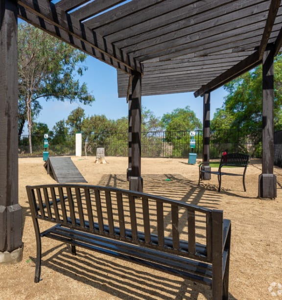 a park bench and a pavilion in a park