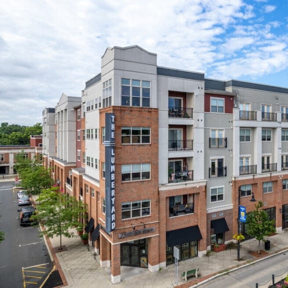 an aerial view of an apartment building on a city street at The Collings at the Lumberyard, Collingswood, 08108