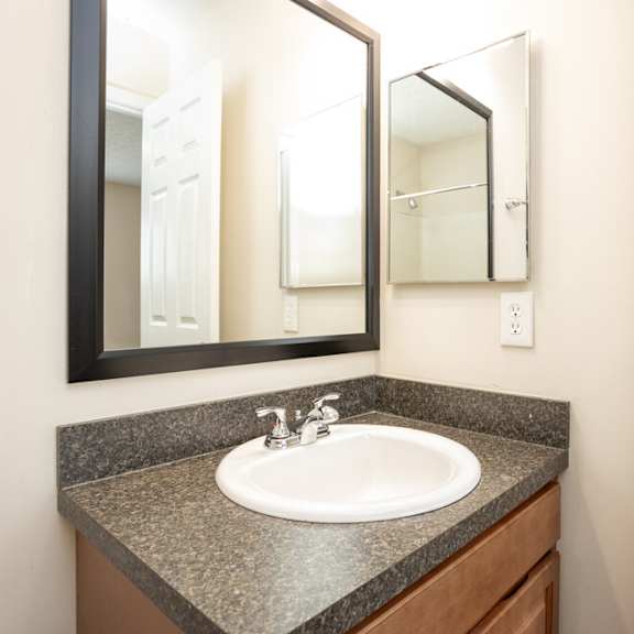 A bathroom sink with a mirror above it.