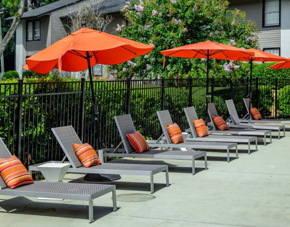 a swimming pool with umbrellas in front of a hotel at Glen Hollow, Georgia, 30034