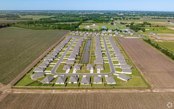 an aerial view of a parking lot of houses